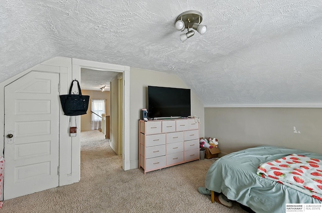 115 N 38th Ave, Omaha, NE 68131 - bedroom featuring a textured ceiling, carpet, and vaulted ceiling