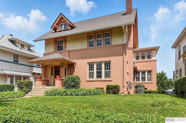115 N 38th Ave, Omaha, NE 68131 - view of front facade with a front lawn, a chimney, stucco siding, and brick siding