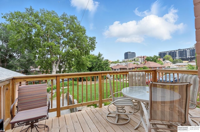 115 N 38th Ave, Omaha, NE 68131 - wooden terrace featuring a lawn and outdoor dining area
