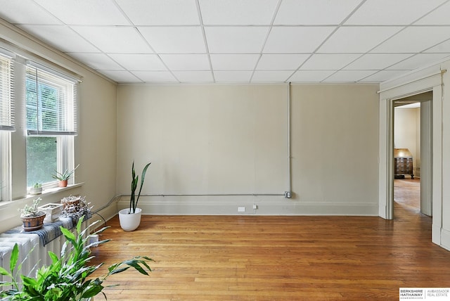 115 N 38th Ave, Omaha, NE 68131 - unfurnished room with wood finished floors and a drop ceiling