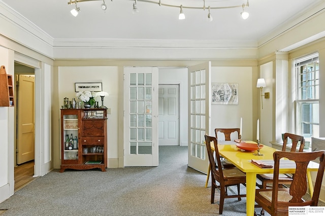 115 N 38th Ave, Omaha, NE 68131 - carpeted dining area featuring french doors and crown molding