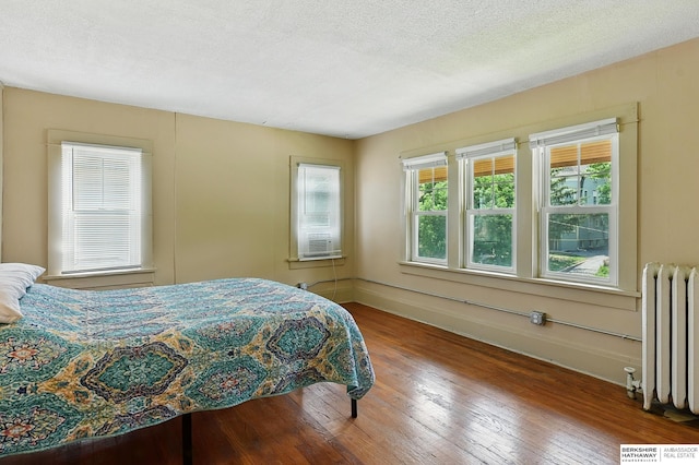 115 N 38th Ave, Omaha, NE 68131 - bedroom with radiator and hardwood / wood-style flooring