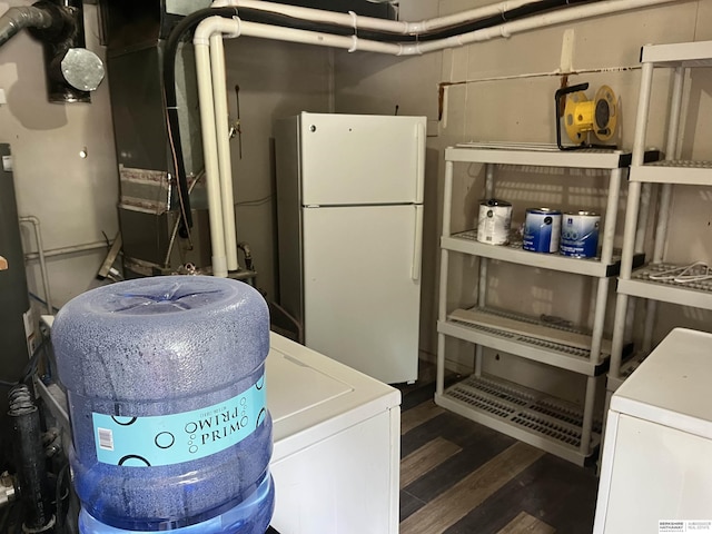 6796 Charles St, Omaha, NE 68132 - basement featuring freestanding refrigerator, wood finished floors, and heating unit