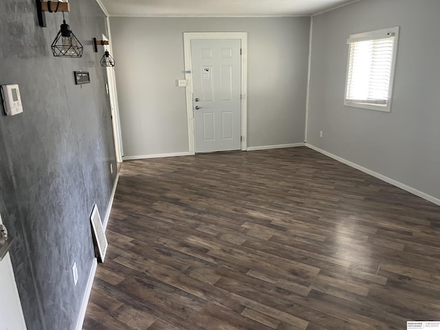 6796 Charles St, Omaha, NE 68132 - unfurnished room featuring dark wood finished floors, ornamental molding, and baseboards