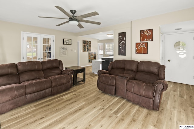 2026 N Park Ave, Fremont, NE 68025 - living room featuring a ceiling fan, light wood-style flooring, and french doors