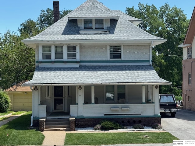 121 N 38th Ave, Omaha, NE 68131 - view of front of home with a porch, a chimney, and roof with shingles