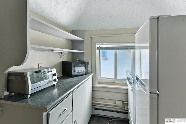 121 N 38th Ave, Omaha, NE 68131 - kitchen with freestanding refrigerator, dark countertops, a textured ceiling, and open shelves