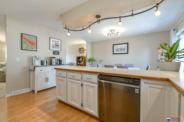 2430 Jameson St S, Lincoln, NE 68512 - kitchen featuring dishwasher, white cabinets, light wood-type flooring, light countertops, and track lighting