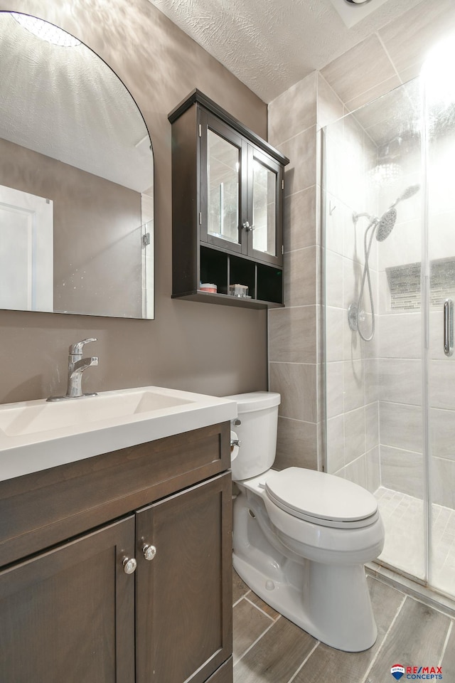 2430 Jameson St S, Lincoln, NE 68512 - full bath featuring toilet, wood finished floors, a stall shower, and vanity