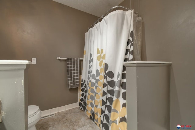 2430 Jameson St S, Lincoln, NE 68512 - full bathroom with toilet and a shower with curtain