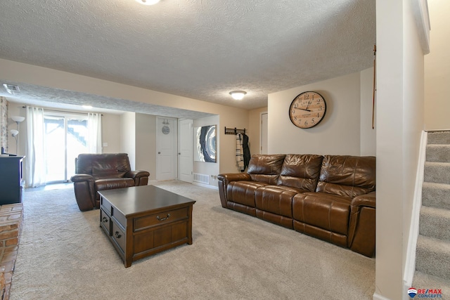 2430 Jameson St S, Lincoln, NE 68512 - living area featuring a textured ceiling, light carpet, and stairs