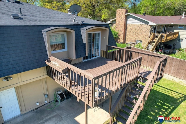 2430 Jameson St S, Lincoln, NE 68512 - wooden terrace featuring stairway and a yard