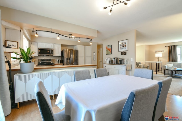2430 Jameson St S, Lincoln, NE 68512 - dining room with track lighting and light wood-style floors