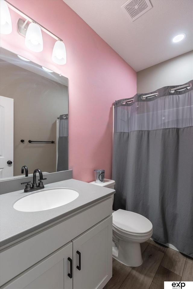 5614 N 177th St, Omaha, NE 68116 - full bathroom with vanity, toilet, wood finished floors, and a shower with curtain