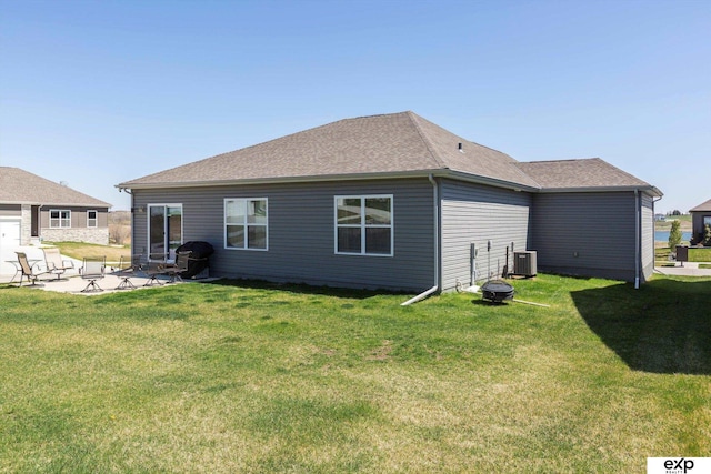 5614 N 177th St, Omaha, NE 68116 - rear view of house with a lawn, a patio, central air condition unit, and a shingled roof