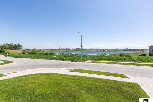 5614 N 177th St, Omaha, NE 68116 - view of road featuring sidewalks, a water view, and street lights