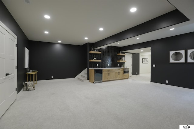 11103 S 173rd St, Omaha, NE 68136 - unfurnished living room with beverage cooler, bar with sink, recessed lighting, and light colored carpet