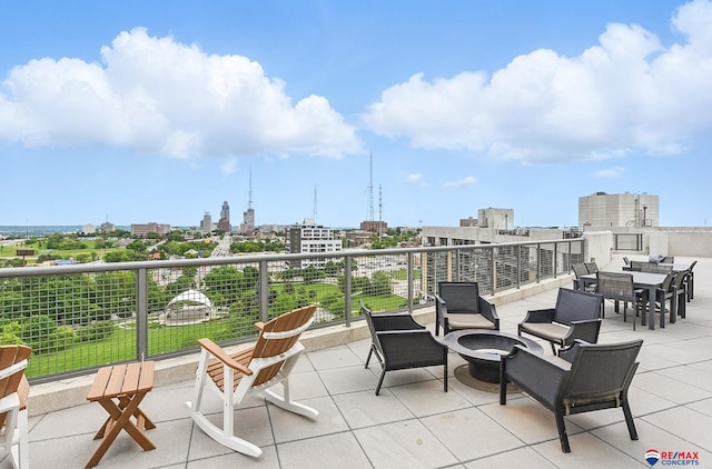 3201 Dodge Ct Unit 5412, Omaha, NE 68131 - view of patio / terrace with an outdoor fire pit and a city view