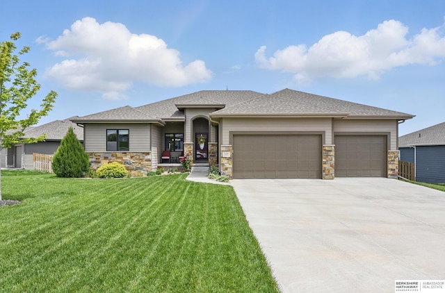 235 N 10th Ave, Springfield, NE 68059 - prairie-style home featuring a garage, a front lawn, driveway, stone siding, and roof with shingles