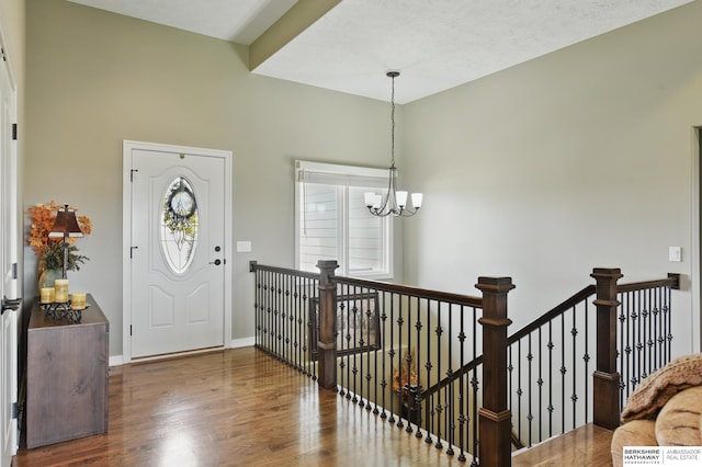 235 N 10th Ave, Springfield, NE 68059 - entryway featuring wood finished floors, a chandelier, and baseboards