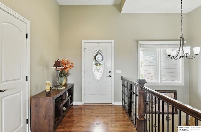 235 N 10th Ave, Springfield, NE 68059 - entrance foyer with a chandelier, wood finished floors, and baseboards