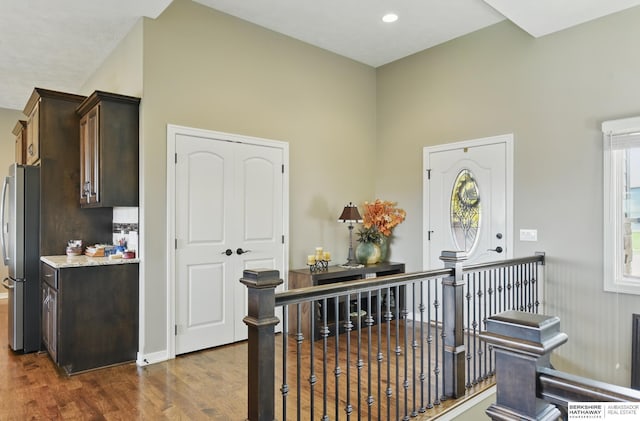 235 N 10th Ave, Springfield, NE 68059 - corridor featuring an upstairs landing, dark wood finished floors, and a high ceiling
