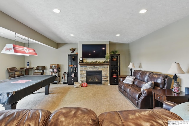 235 N 10th Ave, Springfield, NE 68059 - playroom featuring carpet floors, billiards, recessed lighting, a stone fireplace, and a textured ceiling