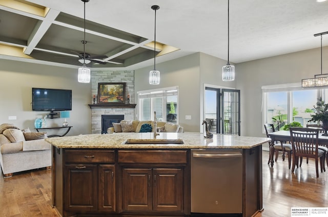 235 N 10th Ave, Springfield, NE 68059 - kitchen featuring dishwasher, a sink, coffered ceiling, open floor plan, and a stone fireplace