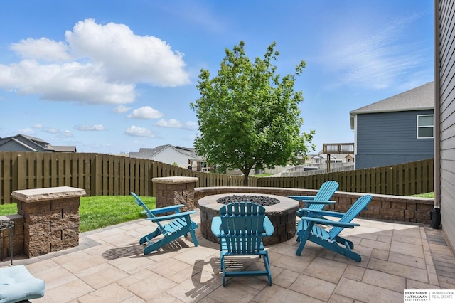 235 N 10th Ave, Springfield, NE 68059 - fenced backyard with a fire pit and a patio area