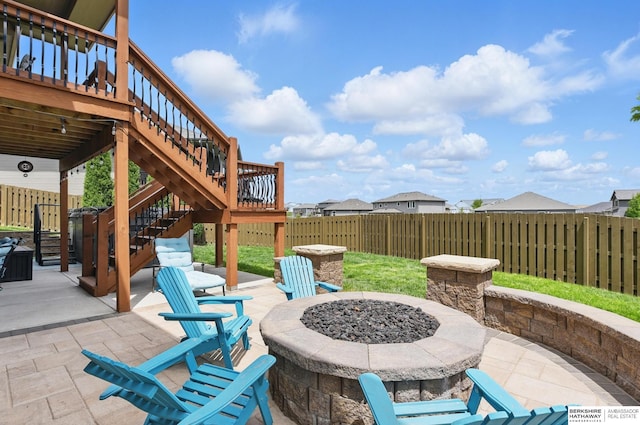 235 N 10th Ave, Springfield, NE 68059 - fenced backyard featuring an outdoor fire pit, a patio area, and stairway