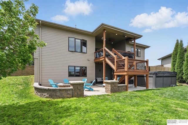 235 N 10th Ave, Springfield, NE 68059 - rear view of house with a patio, a fire pit, a wooden deck, stairway, and a lawn