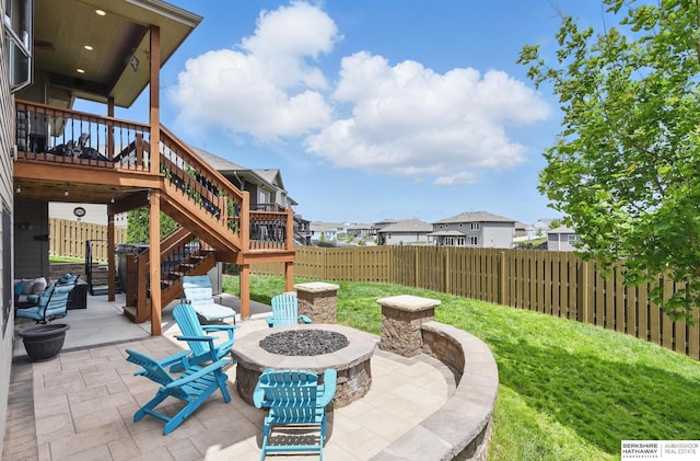 235 N 10th Ave, Springfield, NE 68059 - fenced backyard with an outdoor fire pit, a patio area, stairs, a wooden deck, and a residential view