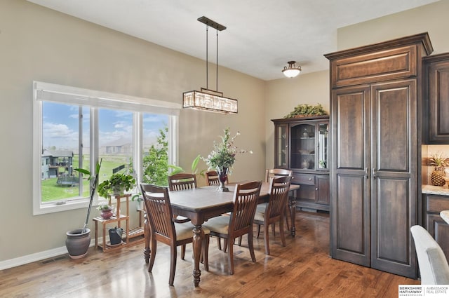235 N 10th Ave, Springfield, NE 68059 - dining room with healthy amount of natural light, wood finished floors, and baseboards
