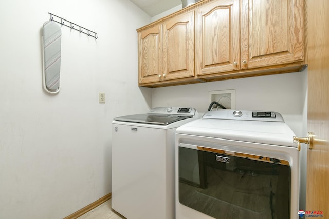 1405 Euclid St, Ashland, NE 68003 - laundry area featuring washer and dryer, cabinet space, and baseboards