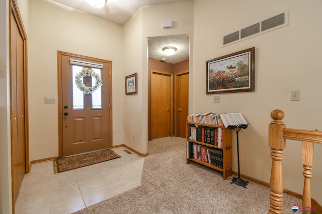 1405 Euclid St, Ashland, NE 68003 - entrance foyer with baseboards, light tile patterned floors, and light colored carpet