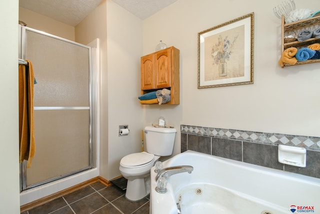 1405 Euclid St, Ashland, NE 68003 - bathroom featuring toilet, tile patterned flooring, a shower stall, and a whirlpool tub