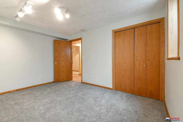 1405 Euclid St, Ashland, NE 68003 - unfurnished bedroom featuring carpet floors, a closet, and baseboards