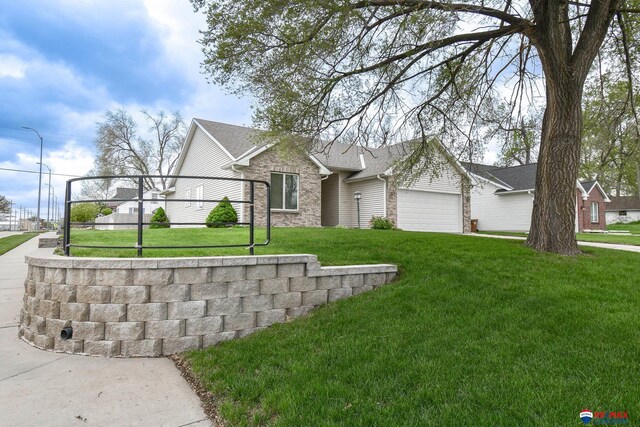 1405 Euclid St, Ashland, NE 68003 - ranch-style house featuring a garage, a front yard, and brick siding