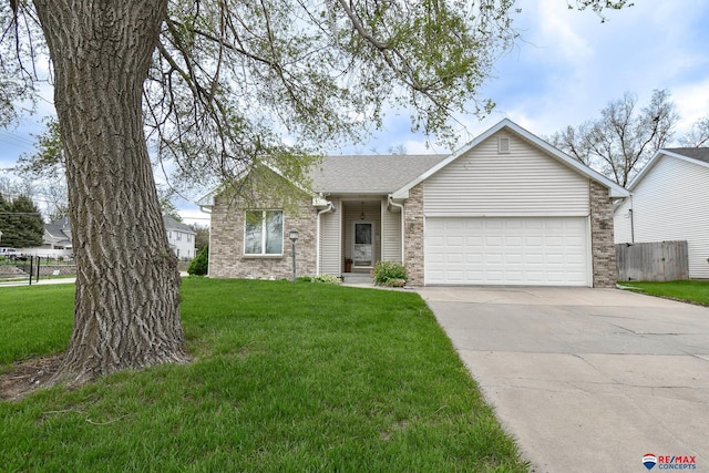 1405 Euclid St, Ashland, NE 68003 - view of front of house featuring a garage, concrete driveway, a shingled roof, and brick siding