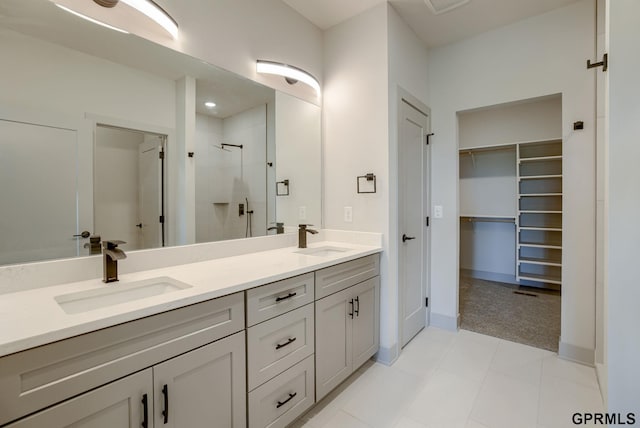 20145 S St, Omaha, NE 68135 - full bathroom with a shower stall, double vanity, a walk in closet, baseboards, and recessed lighting