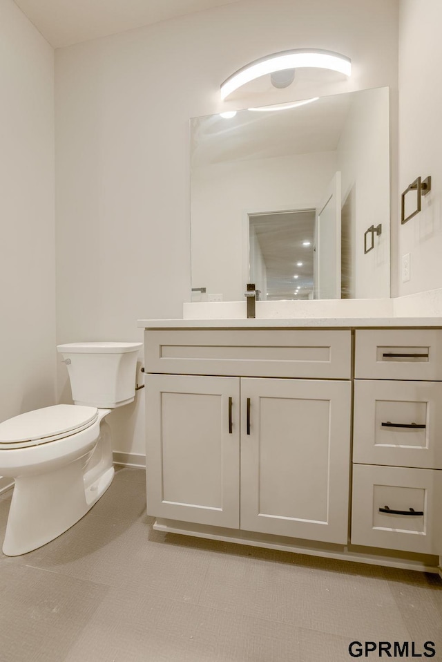 20145 S St, Omaha, NE 68135 - bathroom featuring toilet, vanity, and baseboards