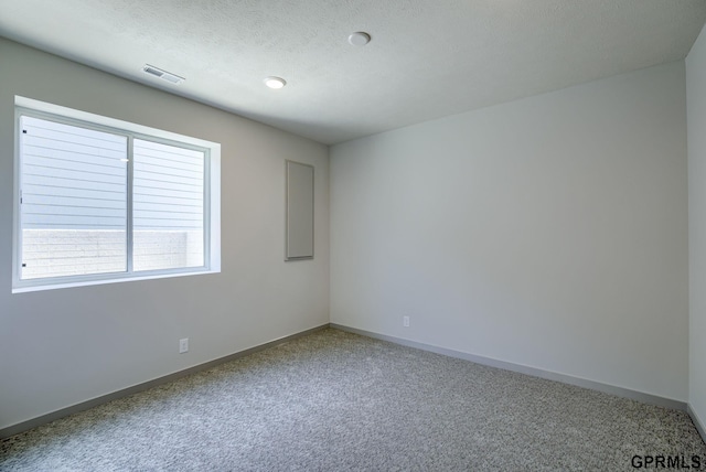 20145 S St, Omaha, NE 68135 - carpeted empty room featuring baseboards and a textured ceiling