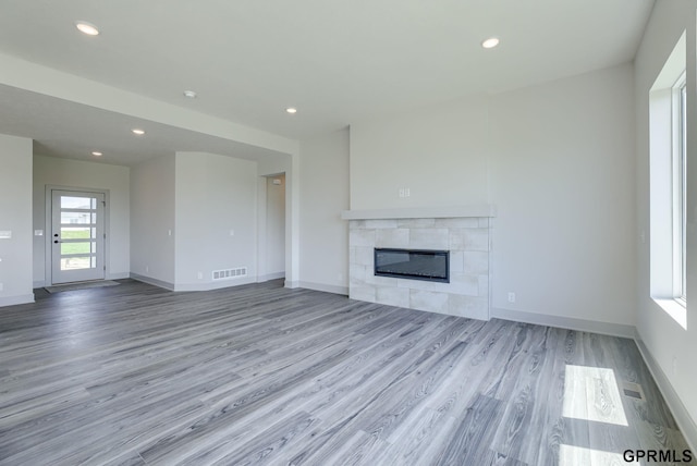 20145 S St, Omaha, NE 68135 - unfurnished living room with wood finished floors, recessed lighting, a fireplace, and baseboards