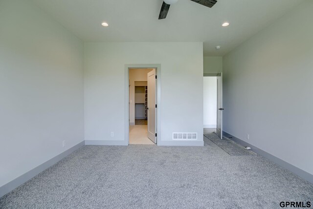 20145 S St, Omaha, NE 68135 - unfurnished bedroom featuring light colored carpet, recessed lighting, a walk in closet, and baseboards
