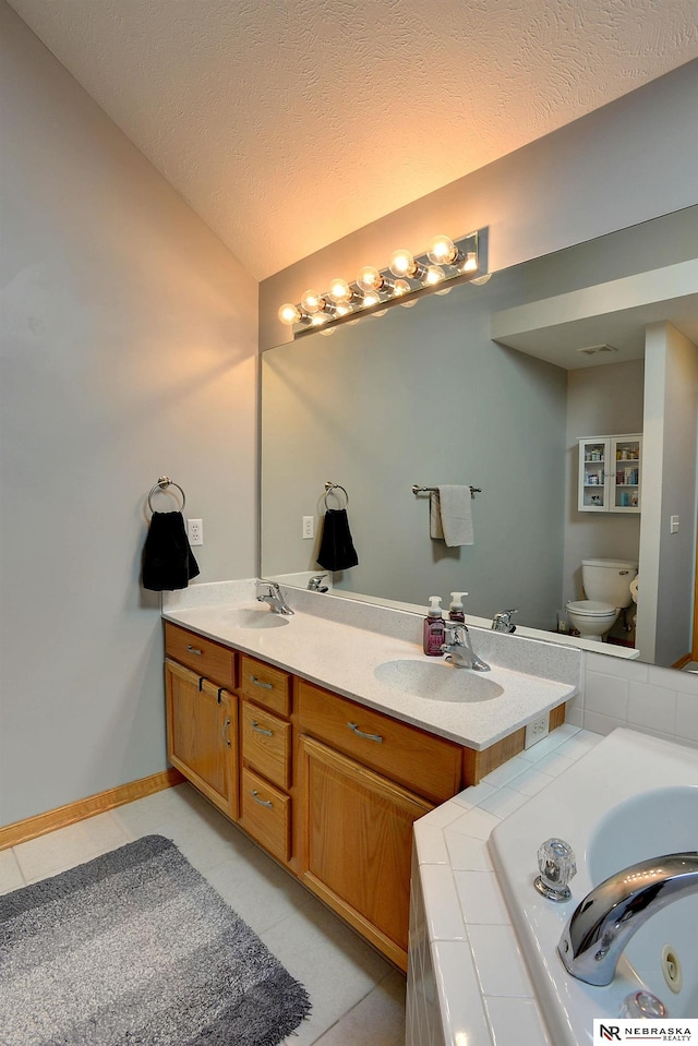 10419 N 150th St, Bennington, NE 68007 - full bathroom with a jetted tub, toilet, double vanity, vaulted ceiling, and tile patterned floors