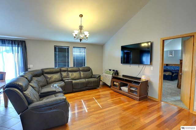 10419 N 150th St, Bennington, NE 68007 - living area featuring vaulted ceiling, a chandelier, light wood-type flooring, and baseboards
