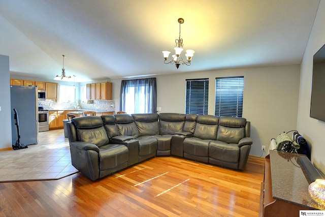 10419 N 150th St, Bennington, NE 68007 - living room featuring a chandelier and light wood finished floors