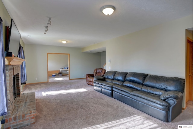 10419 N 150th St, Bennington, NE 68007 - carpeted living room featuring a brick fireplace, rail lighting, stairway, and baseboards