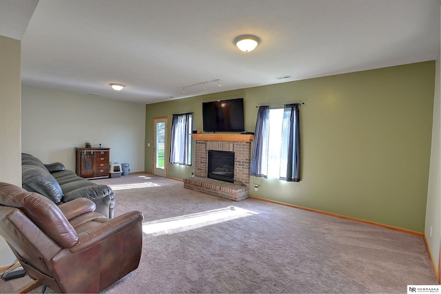 10419 N 150th St, Bennington, NE 68007 - carpeted living room with a brick fireplace and baseboards