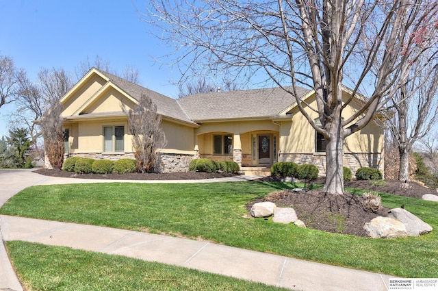 19252 Shirley St, Omaha, NE 68130 - view of front of house featuring stone siding, stucco siding, and a front lawn